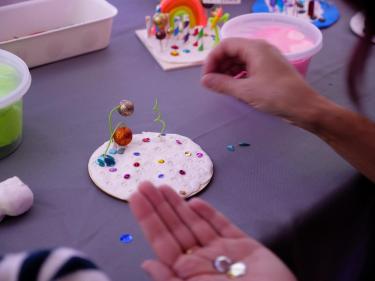 A creative craft is made at the InsideU Pixar room at the VIP grand opening.