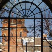 View of Old Main through a paned window