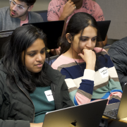 graduate students participating in a coding challenge