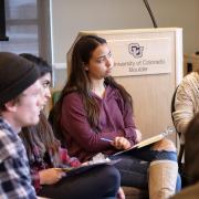 Students listen at workshop session
