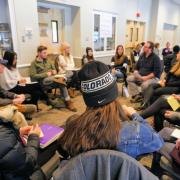 Diversity and Inclusion Summit attendees sit in a circle