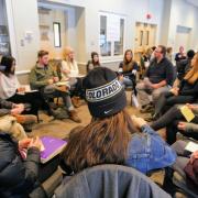 Diversity and Inclusion Summit attendees sit in a circle