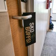 Cool door hangers in Libby Hall. Volunteers, students and parents work together to move students back onto the CU Boulder campus on Sunday, August 19, 2018. (Photo by Glenn Asakawa/University of Colorado)