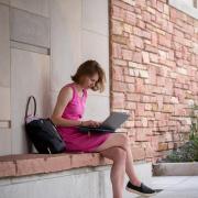 student studying on campus