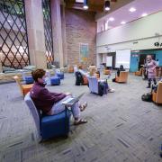 Students wear masks and stay socially distanced during a class at the Norlin Library 