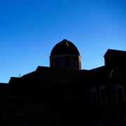 Silhouette of the Leeds School of Business building