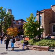 campus community members walking on campus during fall