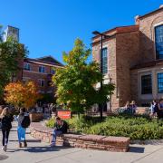 Campus community members walking outside