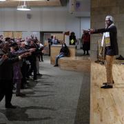 Nii Arma Sowah leads an audience in dance.