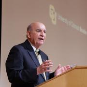 Chancellor Philip P. DiStefano speaks from a lecturn.