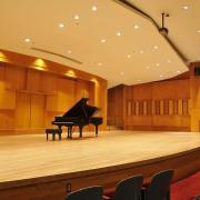 A piano onstage at Grusin Music Hall