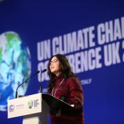 A speaker on the main stage of COP26