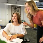 Student and instructor in a computer lab