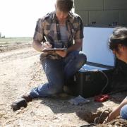 Graduate students install and monitor a seismometer