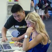 students looking at computer