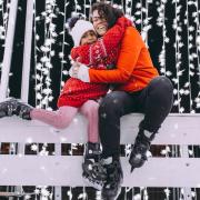 Mother and daughter ice skating