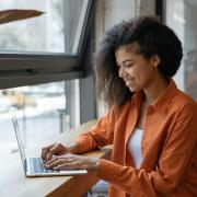 young person working on a laptop