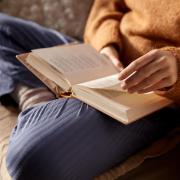 person reading a book of poetry