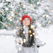 Young person throwing snow in the air