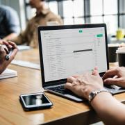 People sit at table in meeting