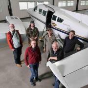 Members of INSTAAR, the University of Maryland and TOFWERK group photo in a hangar