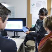 Student shows his work during ATLAS Institute Research Showcase