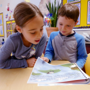  Boy and girl reading a book in the writing class
