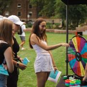 Student spinning a wheel at the Be Involved Fair