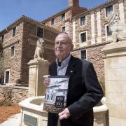 Campus Architect Emeritus Bill Deno poses for photo with new Body & Soul book