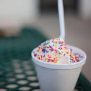 Ice cream with colorful sprinkles in a cup