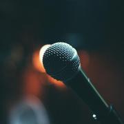 Close-up photo of a microphone on stage