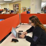 Students at computers in Business Library