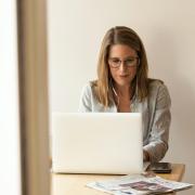 Woman working on laptop in conference room