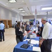 Student engages with employer at campus career fair