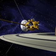 The Cassini spacecraft next to Saturn