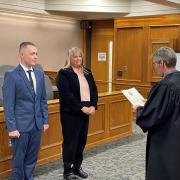 Matt Dillon and his mother Cathy Chestnut being sworn in as CUPD officers