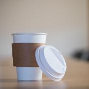 Disposable coffee cup in a board room