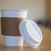 A to-go coffee cup on a table (Patrick Campbell/CU Boulder)