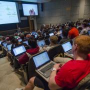 Students with laptops open in classroom