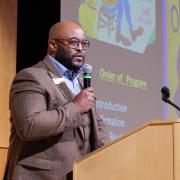 David Humphrey at the podium during a Juneteenth event on campus