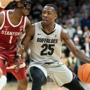 McKinley Wright IV driving to the basket against Stanford