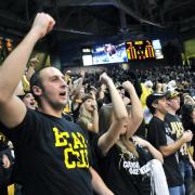 Fans cheer on the CU men's basketball team