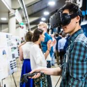 Person using VR headset at CU Engineering Projects Expo