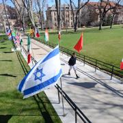 International flags line pathway during Conference on World Affairs 