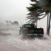 Truck drives on flooded street in Key West, Florida