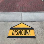 Dismount sign on campus