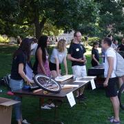 Members of the CU Boulder Physics Department talk at a past open house event