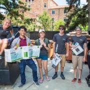 Student volunteers sort recyclables