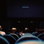 People watch movie in theater