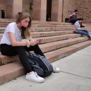 students on campus wearing masks